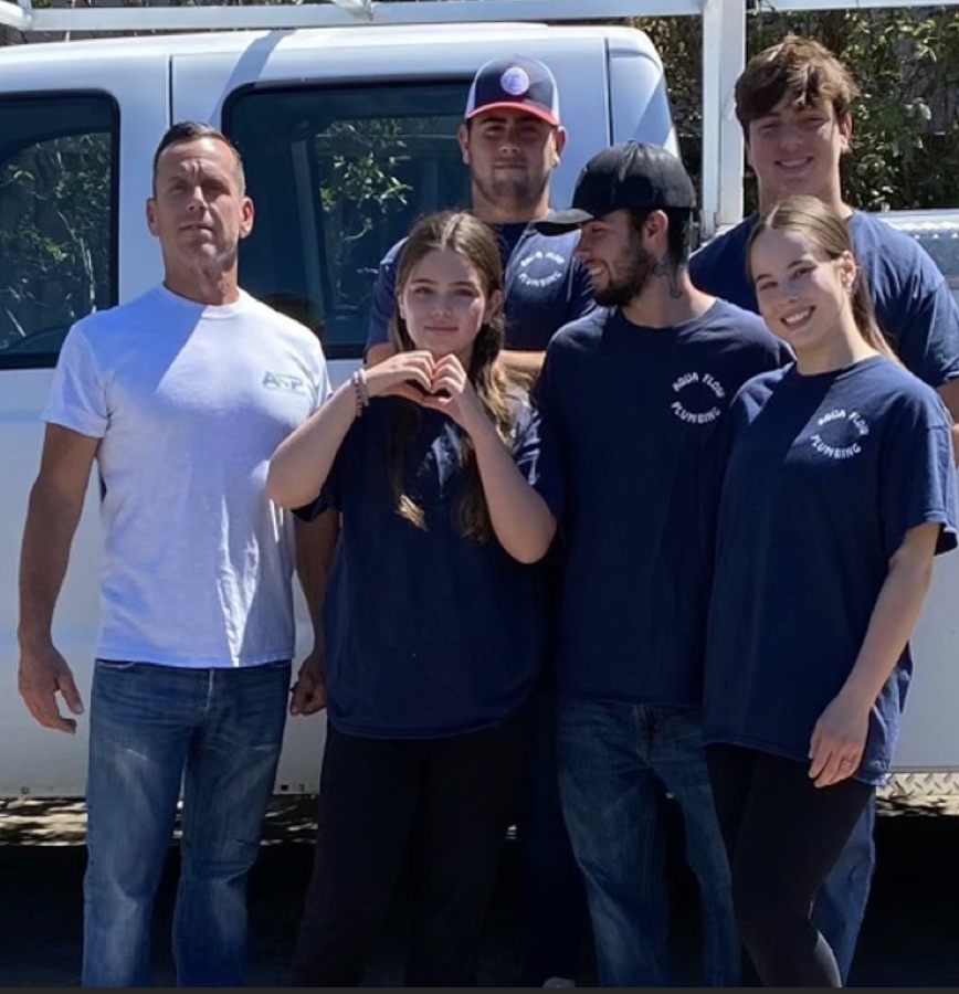 The Aqua Flow Plumbing family team in front of their work truck in San Jose